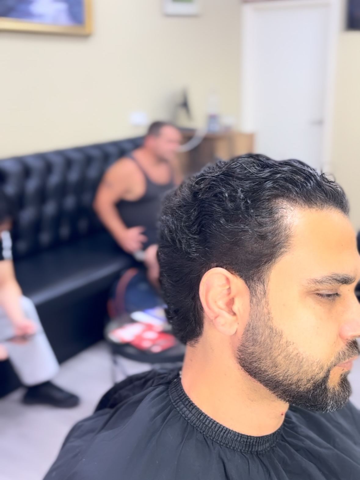 Scissor cut over a client's head